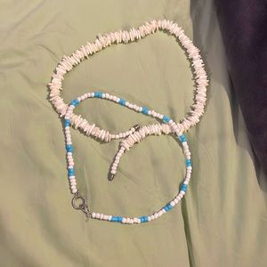 2 pack, 1 puka shell necklace, 1 blue and white bead necklace